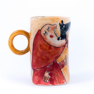 cute ceramic cup portraying red riding hood eating the wolf