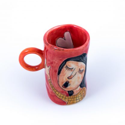 girl singing handmade red ceramic cup
