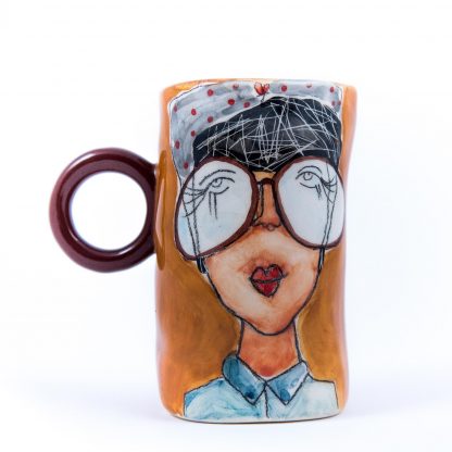 handmade and handpainted ceramic cup with woman portrait